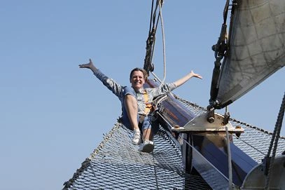 Employee enjoys the feeling of freedom on a traditional sailing ship