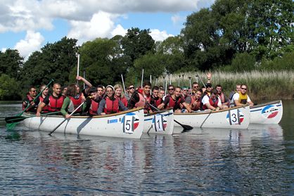 Employee team on a canoe trip on Lake Plön