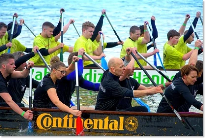 Competition between two dragon boats at a team event in Hamburg