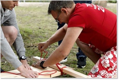 Employees during raft building team event