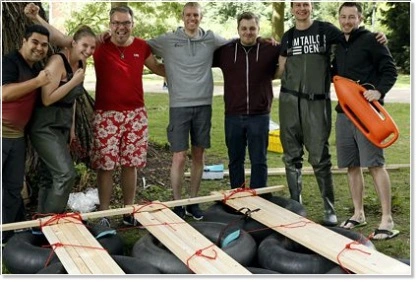 Employee team building the raft