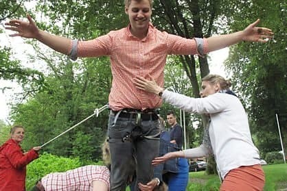 Employees abseiling during a team-building event Employees abseiling during a team-building event