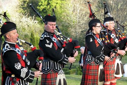 Performance by Scottish bagpipers during a company event