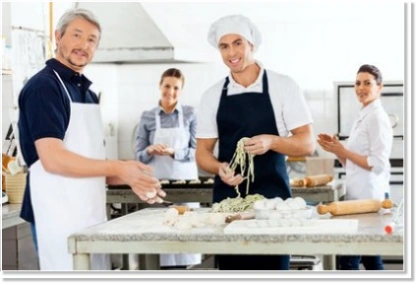 Employees cooking at a team event