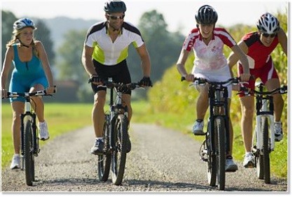 Employees with mountain bikes at a team event Employees with mountain bikes at a team event
